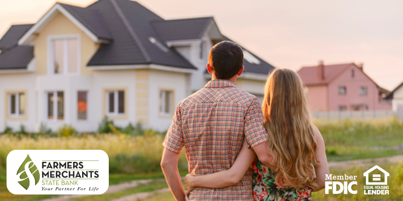 Woman and Man looking at a house