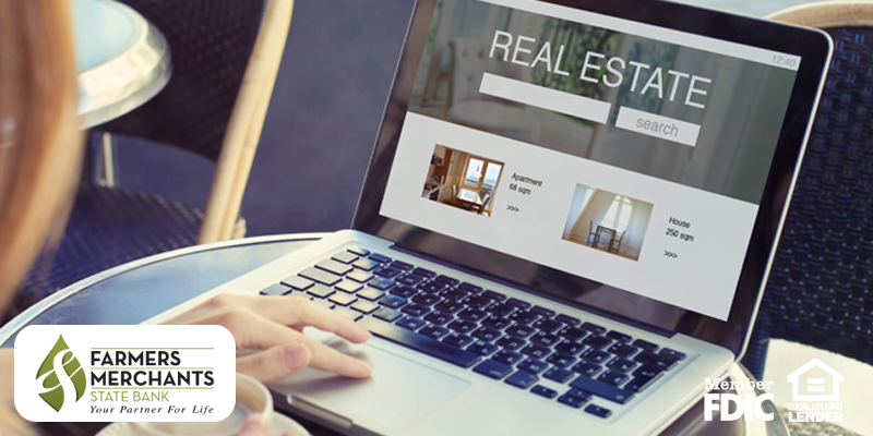 Woman looking at homes online on her laptop