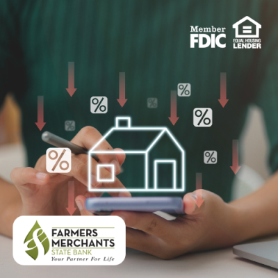 Person holding smartphone with illustration of home and percentage icons with down arrows