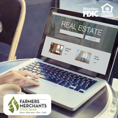 Woman looking at homes online on her laptop