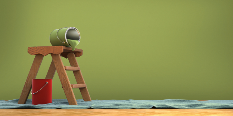 Paint can on top of ladder tipped over with bucket and rug representing home renovations